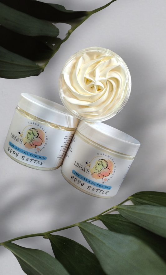 Lissa's Naturally Nourishing The Savage For Him Body Butter surrounded by leaves and shading scenery